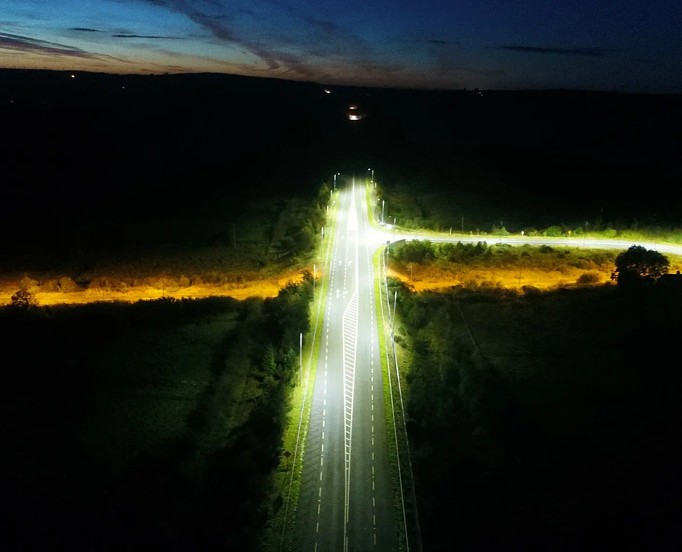Drone photograph of highway at night showing lighting